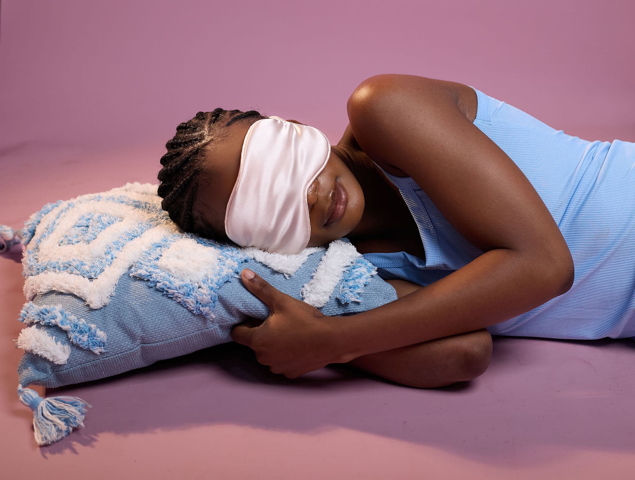Models resting with colorful pillows
